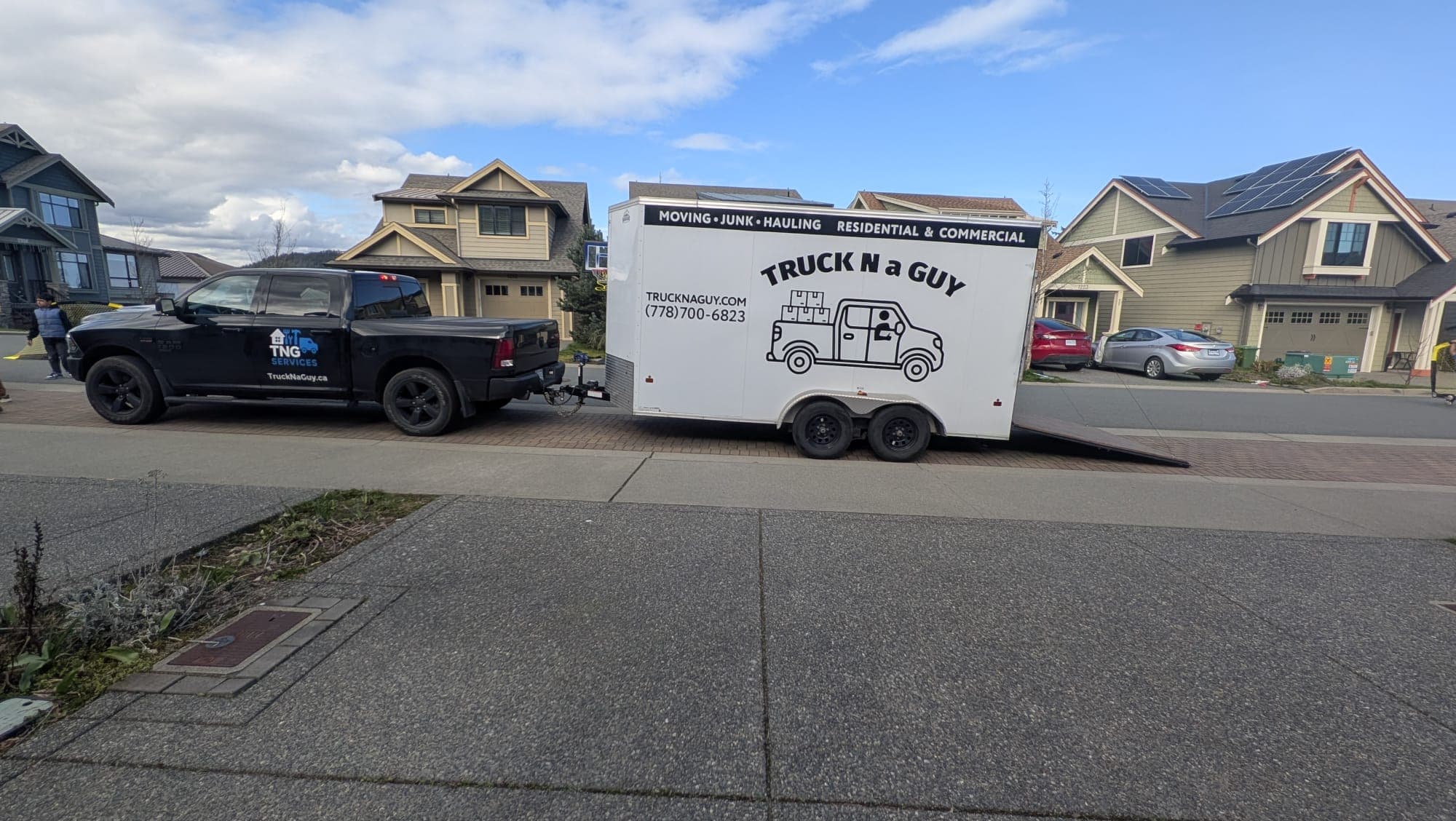 White branded TrucknaGuy truck and trailer